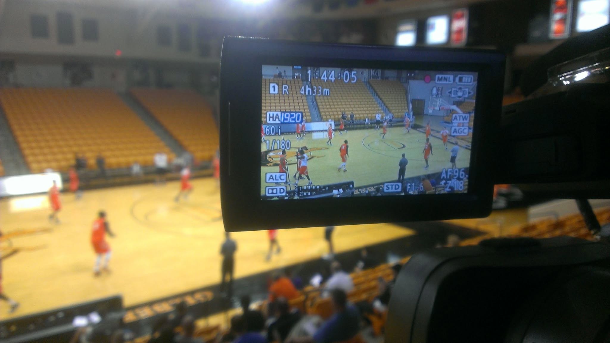 In Focus Studios camera capturing a basketball game from the press box